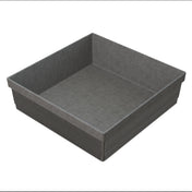 A square, gray, paper baking mold with straight, ribbed sides and a flat base. Its slightly rough texture is similar to that of a cold holding bowl, and the empty mold is viewed at an angle to show interior and exterior details.