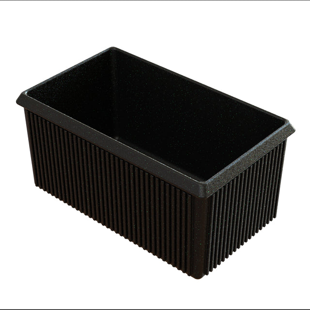 A rectangular black loaf pan crafted from cast aluminum with straight sides and a nonstick interior. The exterior features vertical ridges. The empty pan is photographed on a white background, angled to display both its interior and exterior surfaces.