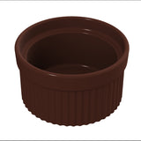 A dark brown, round Souffle Bowl ramekin with a glossy finish and vertical ridges along its sides, viewed from a slightly elevated angle. The interior is smooth and empty, the rim slightly wider than the base, and it's dishwasher safe for easy cleaning.