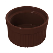 A dark brown, round Souffle Bowl ramekin with a glossy finish and vertical ridges along its sides, viewed from a slightly elevated angle. The interior is smooth and empty, the rim slightly wider than the base, and it's dishwasher safe for easy cleaning.