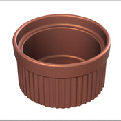 A brown, round souffle bowl with a ribbed exterior and smooth interior, viewed from a slightly elevated angle. The dish has thick walls and a glossy finish, designed for baking or serving individual portions.