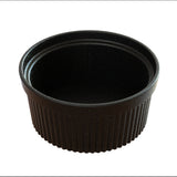 A black, round, ribbed plastic condiment cup or Souffle Bowl is shown against a white background. The cup is empty, with vertical textured lines around its sides and a smooth interior. This container is dishwasher safe for easy cleaning.