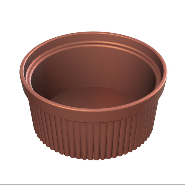 A small, empty, ribbed brown souffle bowl with a smooth inner surface, shown from a slightly elevated angle on a white background. The ramekin has vertical grooves around the outside and a circular, flat bottom.