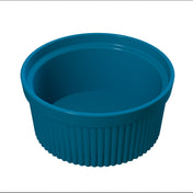 A blue, round souffle bowl with a ribbed, fluted cast aluminum exterior and a smooth interior, shown from a slightly elevated angle on a white background—ideal for cold holding.