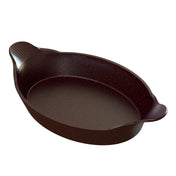 A dark brown, oval-shaped cast aluminum baking dish with two rounded, textured handles on opposite sides. The interior is smooth and slightly reflective, while the exterior has a matte finish—perfect for Au Gratin and dishwasher safe.