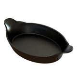 A black, oval-shaped cast aluminum Au Gratin baking dish with two small, textured handles on opposite sides. The glossy, speckled surface is both stylish and practical—dishwasher safe for easy cleanup and ideal for baking or serving food.
