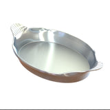 A shiny, oval-shaped cast aluminum au gratin dish with fluted, shell-like handles on each end. The dish has smooth, reflective surfaces and appears empty, displayed against a white background.