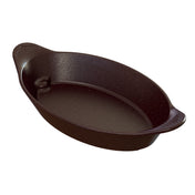 A black oval cast iron baking dish with two small handles on each end. The smooth, slightly glossy interior and matte exterior make it ideal for both baking and cold holding, while its elegant look suits any server’s presentation.