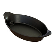 An oval-shaped, black roasting pan with a speckled finish and two small handles on each end. This dishwasher safe server features a glossy surface; the ridged handles offer better grip. The pan appears empty and clean.