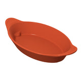 A red, oval-shaped cast aluminum baking dish with two wide, textured handles on either end. The dish has a smooth surface and gently sloping sides, suitable for baking or serving food. The interior and exterior are uniformly colored.