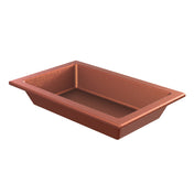 A rectangular, copper-finish food pan with angled sides and a smooth, nonstick interior. The empty pan sits against a white background, clearly showing its depth and shape. This stylish loaf pan is also dishwasher safe for easy cleanup.