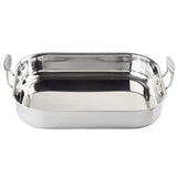 A shiny, tri-ply stainless steel roasting pan with rounded corners and two sturdy handles on opposite sides, photographed on a white background. The reflective surface highlights its clean and unused appearance.