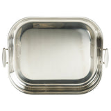 A rectangular tri-ply stainless steel roasting pan with rounded edges, smooth reflective surface, and two white side handles; the pan is empty and photographed from above against a white background.