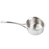 A shiny, stainless steel saucepan with a long, curved handle is oven safe and features a small pouring lip. Its reflective interior is empty, and the handle has a hole for hanging. The background is plain white.