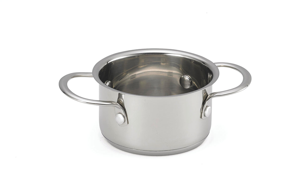 A shiny, oven safe stainless steel pot with two large handles sits on a plain white background. Its smooth, reflective surface and metallic interior make it perfect as a stylish mini server. The pot has no lid.