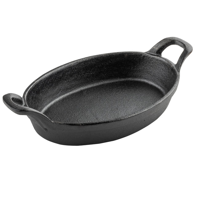A black, oval-shaped Mini Au Gratin Server made of cast iron with two sturdy handles on either end. Its interior and exterior feature a rough, matte texture typical of cast iron, and the dish sits empty against a plain white background.