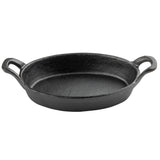 A black cast iron skillet with a round base, slightly raised edges, and two sturdy handles on opposite sides. The smooth, non-stick interior surface makes this Mini Au Gratin Server perfect for serving individual portions. It sits on a white background.