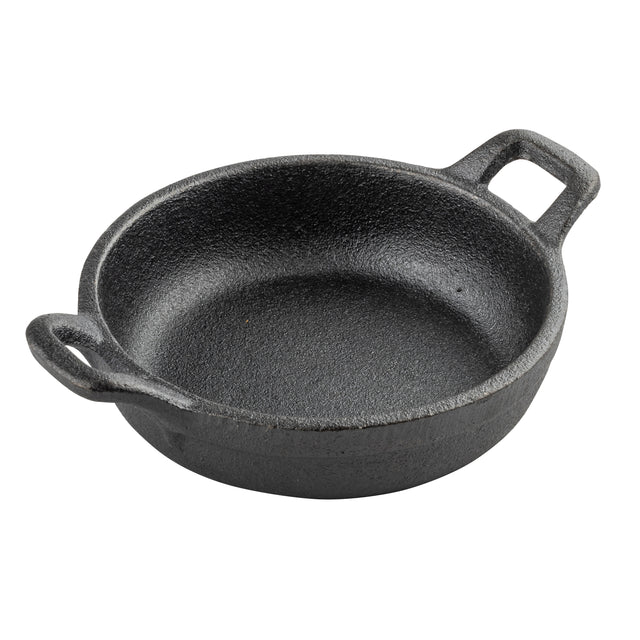 A round, black cast iron Mini Server pan with two short handles on opposite sides. The TableCraft pan features a rough, textured surface and is empty, shown against a plain white background.