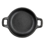A round, black cast iron skillet by TableCraft with a rough texture is viewed from above. Featuring two rectangular handles on opposite sides, this mini server sits empty against a white background.