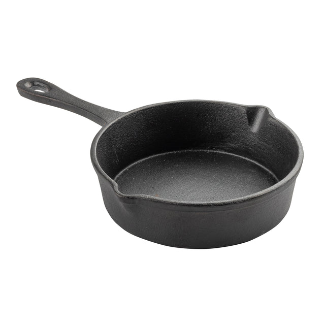 A black cast iron mini skillet by TableCraft, featuring a short handle with a hanging hole, round shape, dual pouring spouts, and a textured surface for a sturdy, rustic look. The background is plain white.