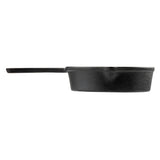 A black cast iron saucepan by TableCraft is shown in profile on a white background. It features a long, straight handle and slightly textured exterior. The deep pan includes a small pouring spout on the side.