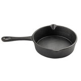 A small, round TableCraft cast iron mini skillet with a long handle and a hole at the end. It features two pouring spouts on opposite sides, and the smooth, seasoned interior is set against a plain white background.