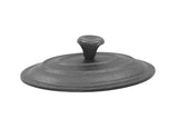 A round, dark gray TableCraft cast iron lid with a raised central handle. The textured surface and slightly curved edges are designed to fit snugly on a pot or mini casserole. A plain white background highlights the lid's details.