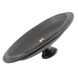 A black, circular TableCraft cast iron object with a flat, wide brim and a raised central knob on the bottom, resembling a mini casserole lid or vintage industrial wheel, photographed slightly tilted on a white background.