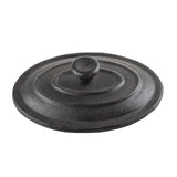 A round, black, cast iron Mini Casserole Lid from TableCraft features concentric raised rings and a central knob handle. Its matte, slightly textured surface highlights its sturdy, heavy-duty design for use with cast iron cookware.