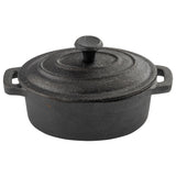 A round, black cast iron Dutch oven with side handles and a matching lid featuring a central knob and concentric ridges. This TableCraft piece has a textured, matte surface, characteristic of seasoned cast iron cookware.