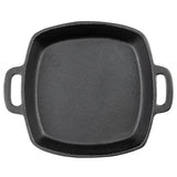 A black cast iron square skillet, induction ready, is seen from above with slightly rounded edges and two wide handles. The skillet’s textured, matte surface stands out against a plain white background.