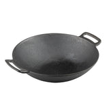 A black cast iron wok with a wide, round base and high, sloping sides. Induction ready, it features two short, sturdy handles for easy lifting. The wok sits on a plain white background.