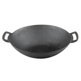 A black induction ready cast iron wok with a wide, round base and high sloping sides. It features two sturdy loop handles for easy gripping. The seasoned, slightly textured surface is empty and showcased on a white background.