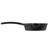 A TableCraft cast iron Mini Skillet is shown from the side on a white background. It features a long, flat handle extending to the left and a thick, deep base with slightly angled sides, giving it a sturdy and heavy appearance.