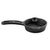 A small, black TableCraft Mini Skillet with a long handle, round shape, and two pouring spouts; its surface has the slightly rough, matte texture typical of cast iron cookware. The skillet is isolated on a white background.