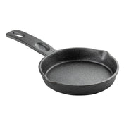 A small, round TableCraft mini skillet made of black cast iron with a textured surface, a short handle featuring a hole for hanging, and two pour spouts on opposite sides. The skillet is empty and shown on a white background.