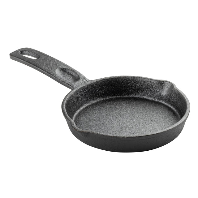 A small, round TableCraft mini skillet made of black cast iron with a textured surface, a short handle featuring a hole for hanging, and two pour spouts on opposite sides. The skillet is empty and shown on a white background.