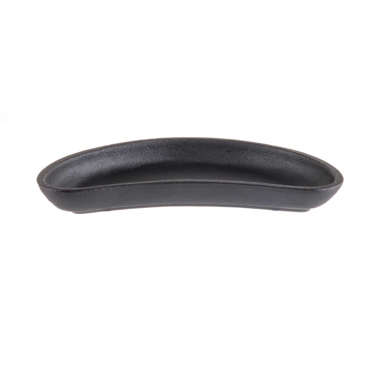 A black, oval-shaped TableCraft server with curved sides and a smooth matte finish sits centered against a plain white background. The shallow dish appears to be made of ceramic or cast iron.
