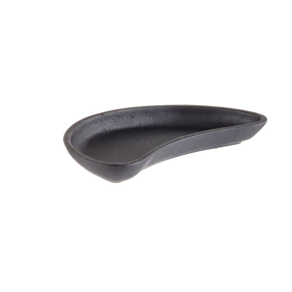 A black, kidney-shaped TableCraft cast iron server is shown against a plain white background. The dish features smooth, slightly raised edges and a textured interior, with its widest part on the left gently curving to a narrower point on the right.