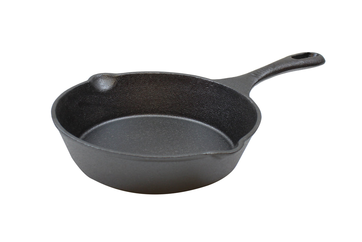 A black cast iron skillet with a textured surface sits on a white background. This induction ready skillet features a single handle with a hole for hanging and small pour spouts on each side of the rim.