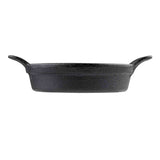 A black, oval-shaped TableCraft Mini Server cast iron baking dish is shown from the side. It features a textured surface with two curved handles on opposite ends and sits on a plain white background.