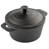 A black TableCraft cast iron Dutch oven with a matching lid and two handles sits on a white background. The surface has a rough, textured finish, and the lid features a round knob handle at the center—perfect for serving mini casseroles.