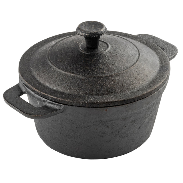 A black TableCraft cast iron Dutch oven with a matching lid and two handles sits on a white background. The surface has a rough, textured finish, and the lid features a round knob handle at the center—perfect for serving mini casseroles.