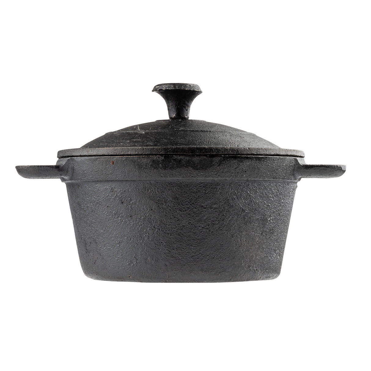 A black cast iron Dutch oven by TableCraft with a matching lid, side handles, and a top knob. This mini casserole pot features a rough, textured surface and sits on a white background.