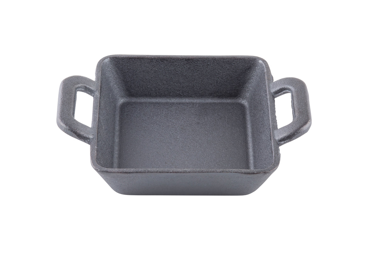 A square black cast iron baking dish with two handles, viewed from above on a white background. This TableCraft mini server features a textured surface and no lid, perfect for stylish tabletop presentations.