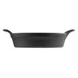 A black TableCraft cast iron pan is shown from the side with a rough texture. It features two short, curved handles and a deep, rectangular shape, resembling a fajita platter. The pan is set against a plain white background.