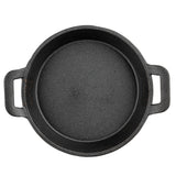 A top-down view of a round, black TableCraft cast iron skillet with two short handles on opposite sides. The fajita platter has a slightly rough texture and appears empty, resting on a white background.