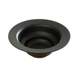 A black, round, wide-rimmed cast aluminum salad bowl with gently sloped sides and a textured, speckled surface. Its interior features concentric circular steps for a sculptural, layered design. The background is plain white.
