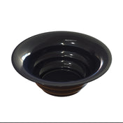A glossy, black salad bowl made of cast aluminum with a wide rim and deep interior featuring concentric circular steps, resembling a panning tray. Ideal for cold holding, it reflects light on its smooth surface against a plain white background.