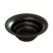 A round, black cast aluminum bowl with gradually flared sides and a smooth, glossy finish is shown. The surface is speckled with small white dots, resembling a starry night sky. Ideal as a salad bowl for cold holding on any table setting.